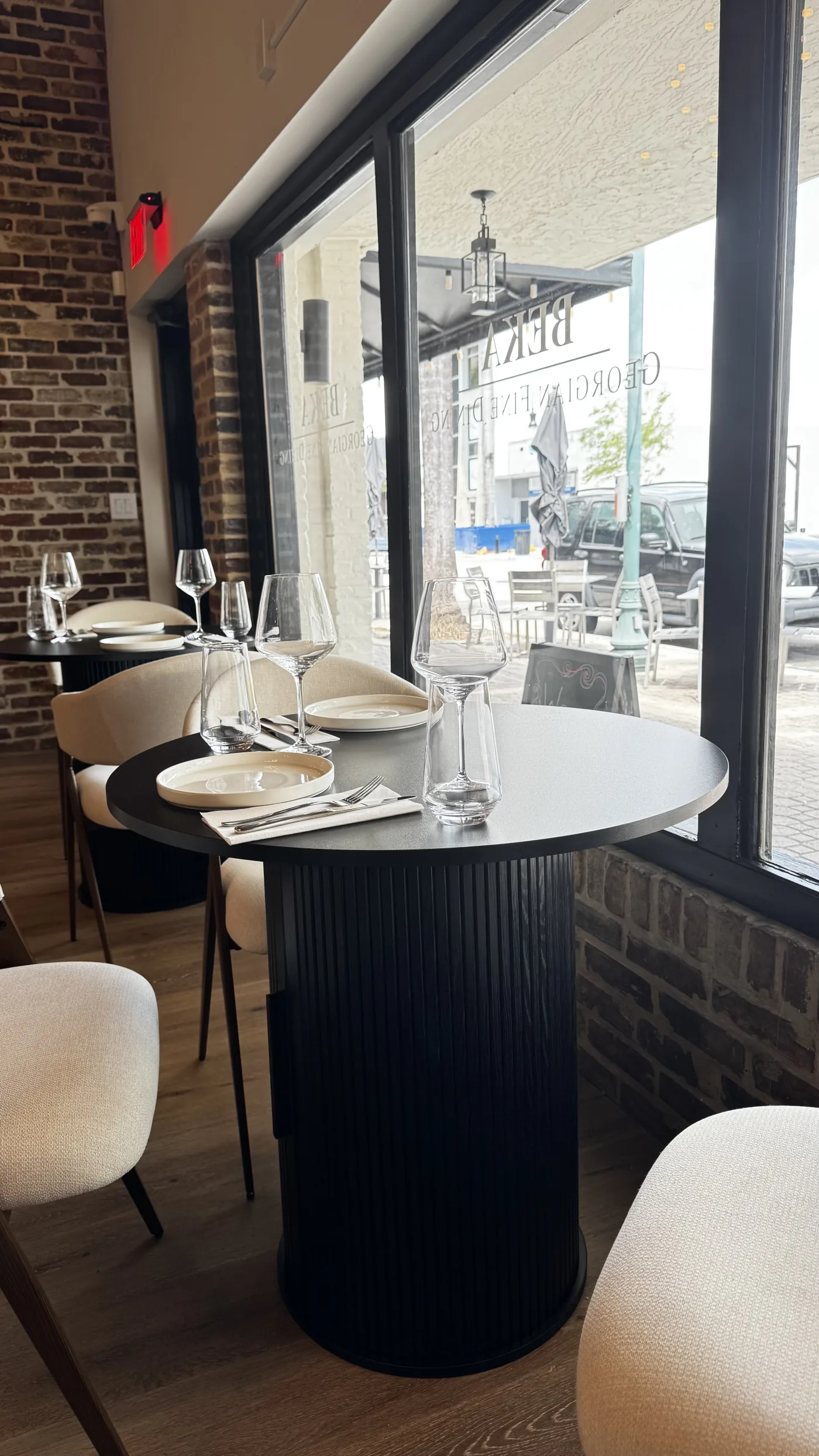 BEKA dining room — cream bouclé chairs at the bar, Hollywood, Florida